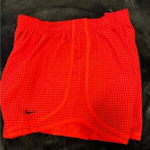 Nike DRI-FIT running shorts.
